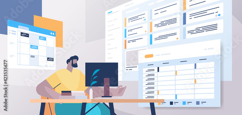 businessman at workplace planning day scheduling appointment in online calendar app agenda meeting plan