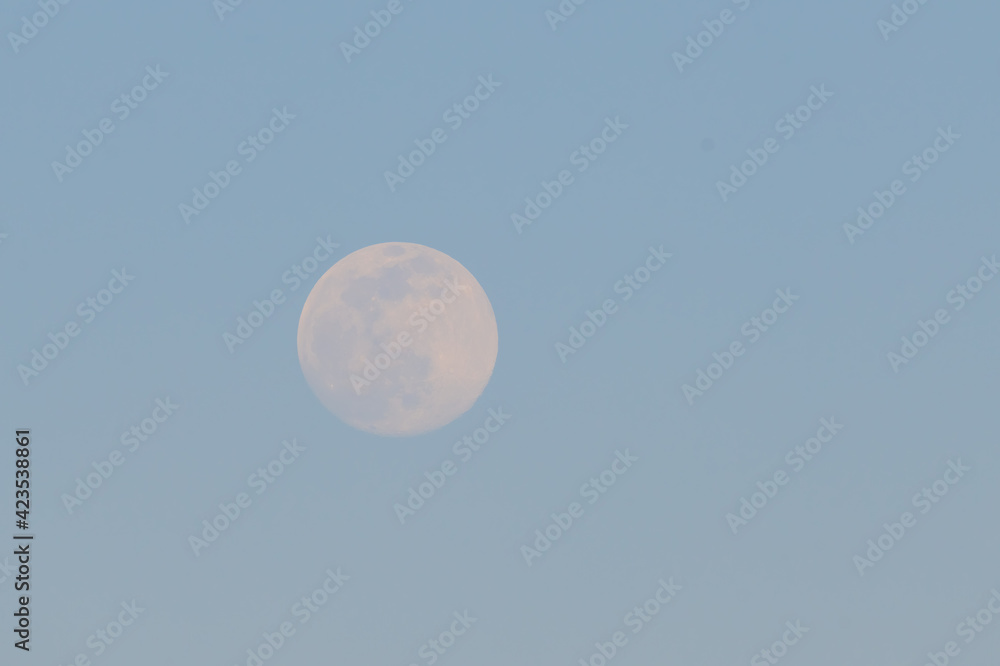 Full moon on blue sky