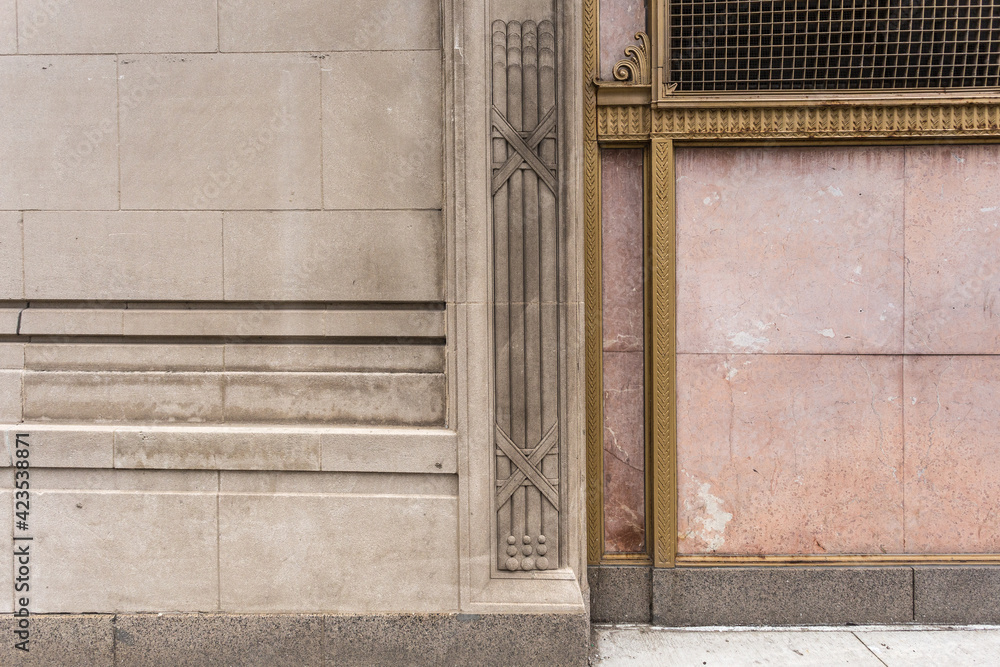 Various lines and art deco design on side of block building in urban Chicago
