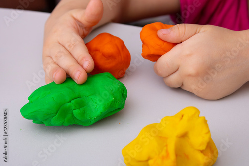 Toddler boy doing sensory playful exercise, close up