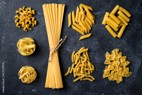 Various types of pasta. Pasta on black background.