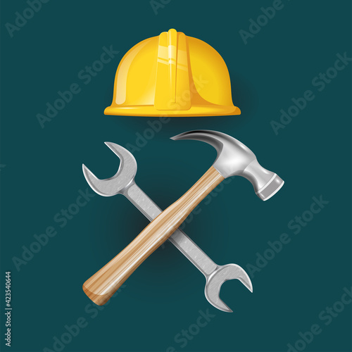 helmet constr with hammer and wrench photo