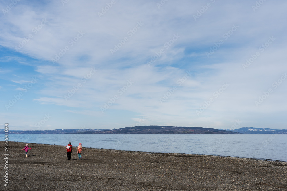 Walking by Lake Mjøsa in spring. Walking by Lake Mjøsa in spring.