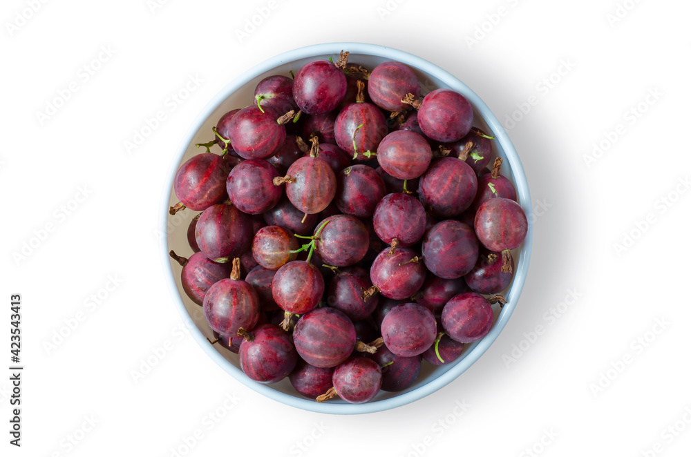 Obraz premium Red gooseberry. Ripe berries in a white plate. Isolated on white