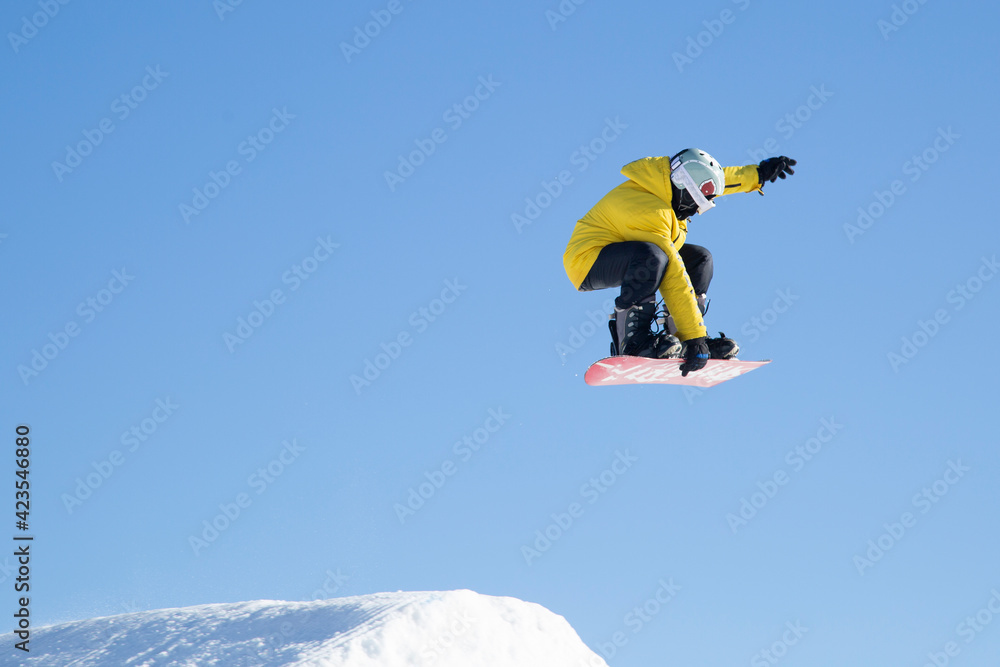 A snowboarder on a snowboard. Extreme winter sports.Rest in winter.