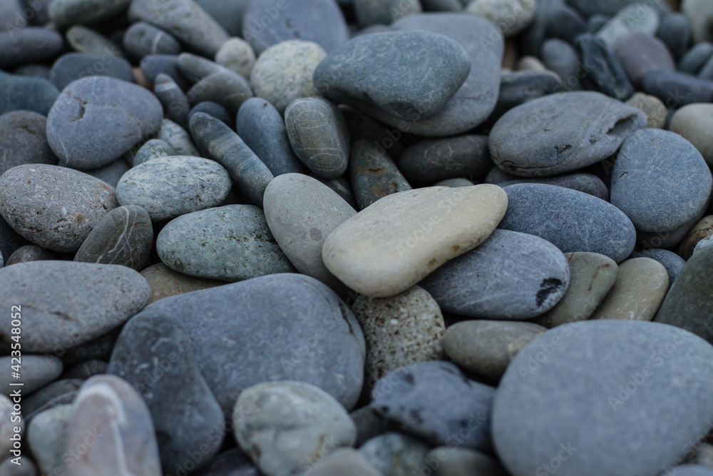 Many small, different sizes of marine stones on the shore. Many small, different sizes of marine stones on the shore.