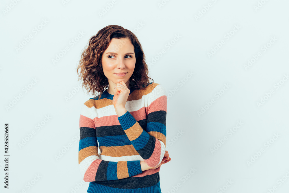 Happy young woman wondering while standing Happy young woman wondering while standing