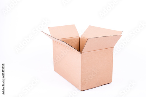 Open cardboard box on white background, mid sized, empty © lukaspuchrik