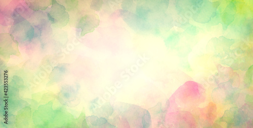 colorful watercolor background in green blue pink and yellow spring or Easter colors, abstract sunny bright bokeh blur design 