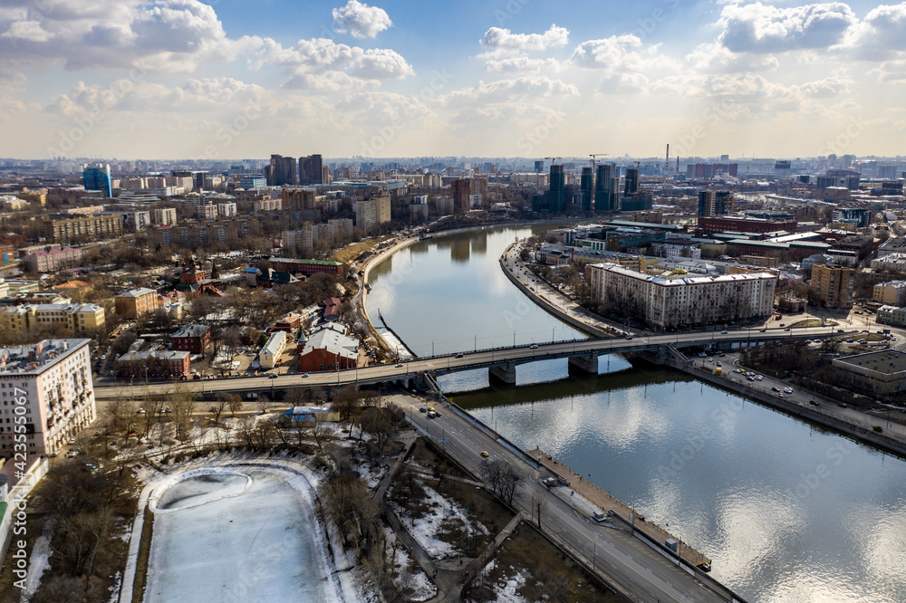 panoramic view from drone on cityscape with river and bridges 