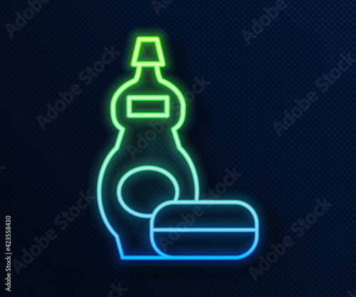 Glowing neon line Dishwashing liquid bottle icon isolated on blue background. Liquid detergent for washing dishes. Vector