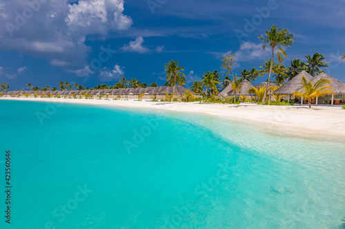 Fototapeta Naklejka Na Ścianę i Meble -  Summer vacation at Maldives resort. Stunning beach scene with villas and palm trees, white sand, blue sky, idyllic nature landscape. Seaside, tropical island paradise. Relax, freedom, carefree concept