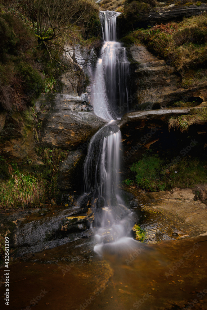 close up of the john knox waterfall in the lomond hills, fife, scotland.