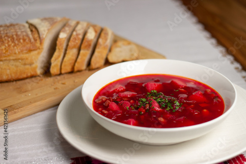 Plate with red soup. Soup with beets.