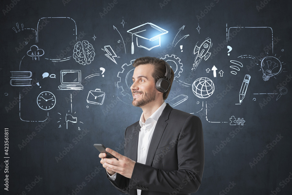 Businessman wearing suit is learning and studying by listening p Businessman wearing suit is learning and studying by listening p