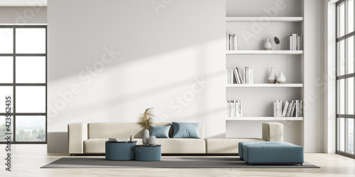 Contemporary living room interior with white wall and panoramic window