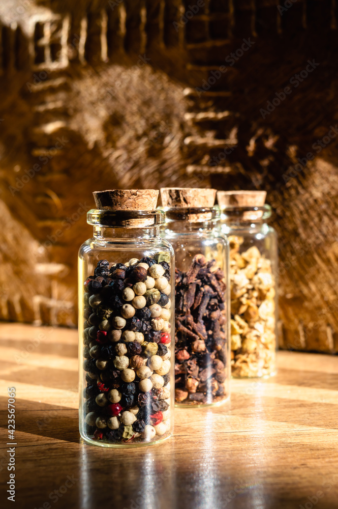Glass bottles with dried spices Glass bottles with dried spices