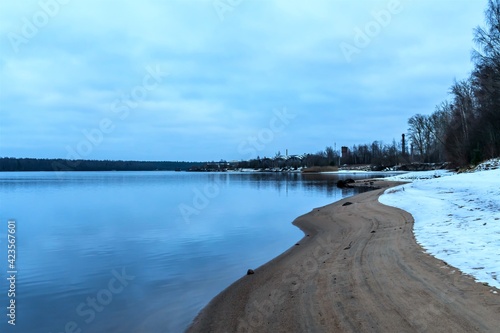 Winter bank of the Svir River in cloudy weather.