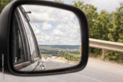 Vehicles on the road viewed from the side mirror of car © berna_namoglu