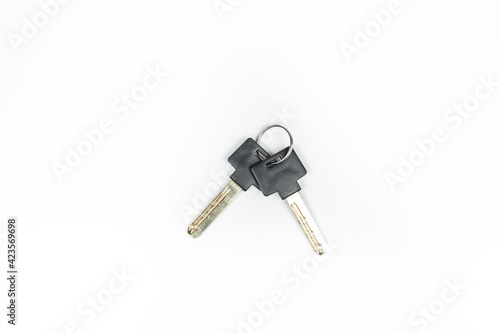 a bunch of metal keys on a white background