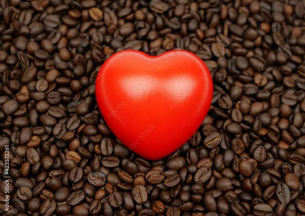 Red heart with Blurred roasted coffee beans on a white background.
Red heart with Blurred roasted coffee beans on a white background.