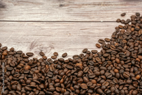 Coffee beans on wood background 