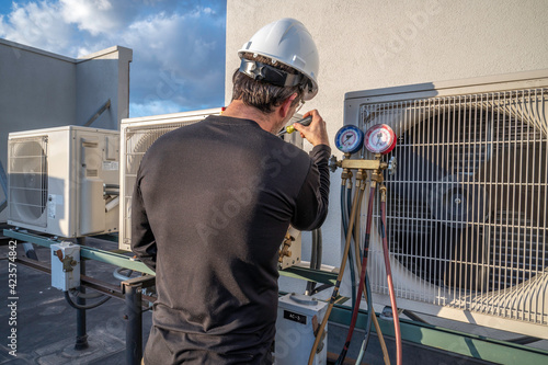 HVAC mechanic servicing a mini split AC