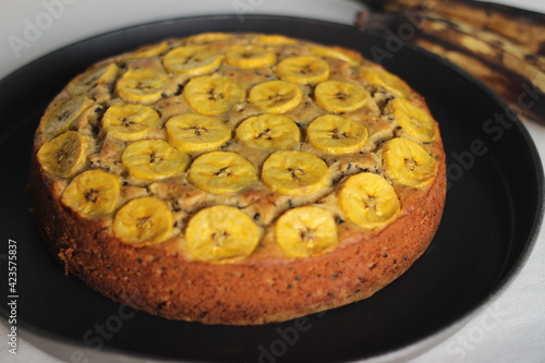 Home baked Plantain cake with sliced plantain as topping photo