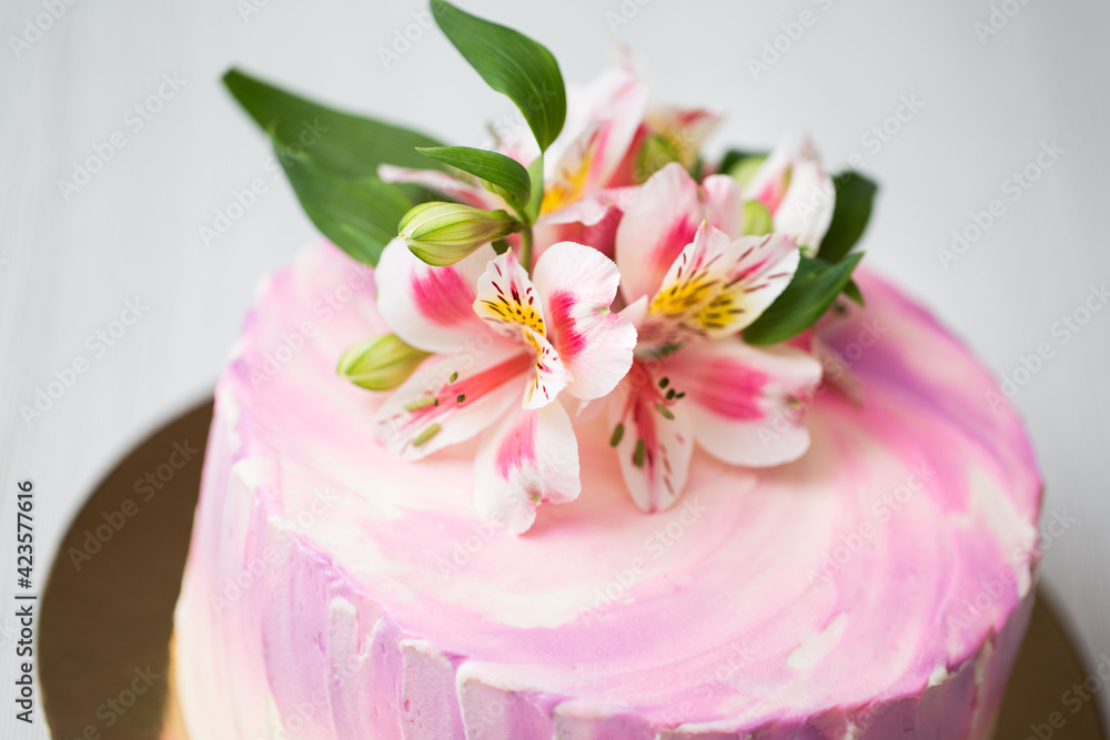 Cake with pink decor and flowers Cake with pink decor and flowers