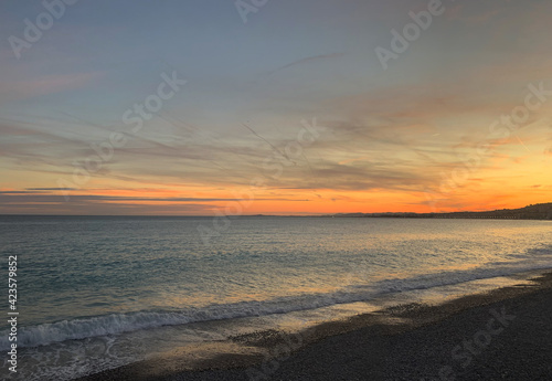 Fototapeta Naklejka Na Ścianę i Meble -  Sunset on the French Riviera (Cote d'Azur). Pebble beach. Nice