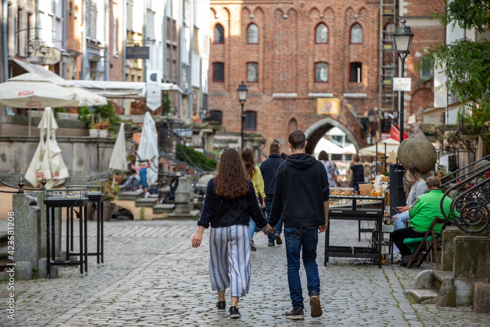 Group of people on Mariacka Street, the main shopping street for the amber and jewelry in the old hanseatic city of Gdansk, Poland.