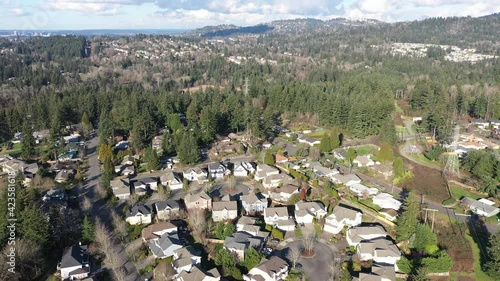 Cinematic aerial drone dolly footage of Renton, Newcastle, Highlands Park, May Creek, Kennydale, residential Seattle neighborhoods in King County, with Cougar Mountain and Bellevue in the background