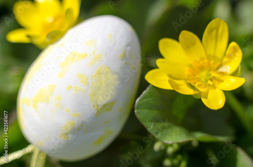 A yellow Easter egg in beautiful yellow colors. Easter composition