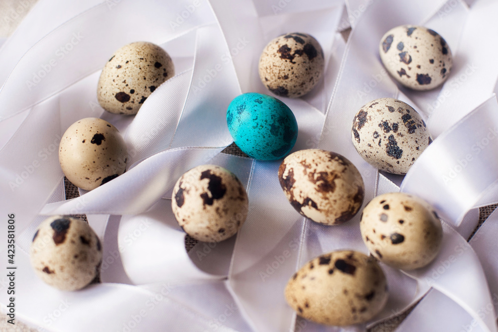 easter eggs on a background of satin ribbons easter eggs on a background of satin ribbons