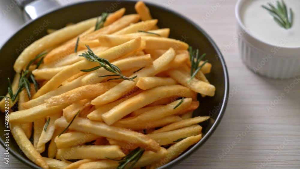 French fries or potato chips with sour cream and ketchup French fries or potato chips with sour cream and ketchup