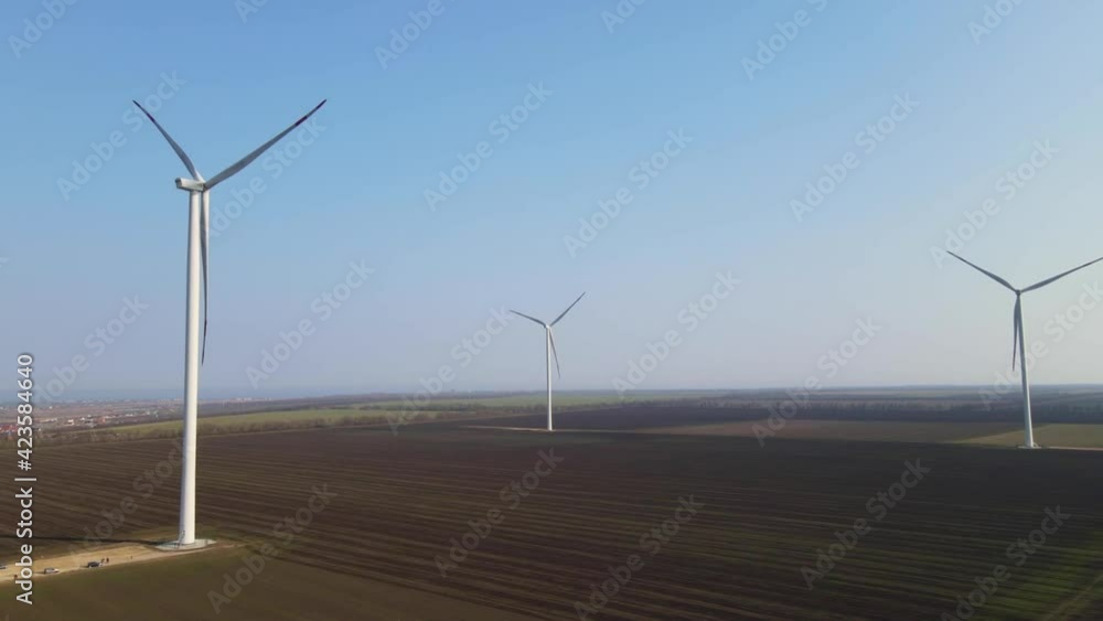 wind-farm in the evening, sustainable energy, renewable energy concept, rural landscape with wind-turbines, ecological energy source