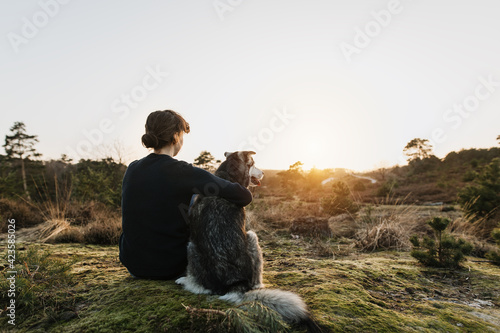Photography Person hugging a dog outdoors in beautiful nature