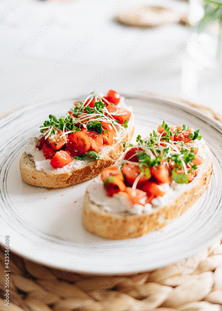 bruschetta with tomato, ricotta and basil