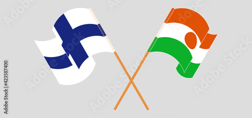 Crossed flags of Finland and the Niger. Official colors. Correct proportion