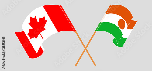 Crossed flags of Canada and the Niger. Official colors. Correct proportion