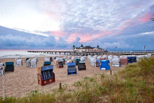 Fototapeta Naklejka Na Ścianę i Meble -  morning time at baltic sea beach and sight Ahlbeck pier in sunrise