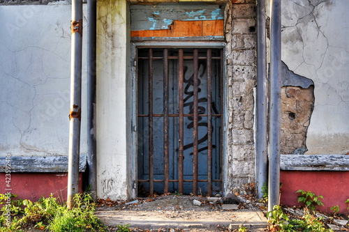 A bricked-up door with iron bars. Moscow
