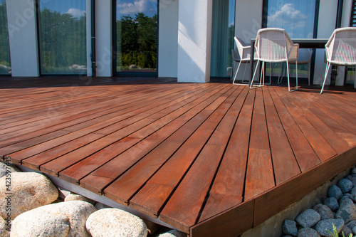 Print op canvas Ipe wood deck, modern house design with wooden patio, low angle view of tropical