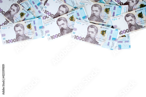 1000 Ukrainian hryvnias bills lies isolated on white background with copy space stacked in fan close up