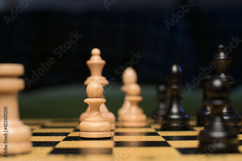 black and white figures on the chessboard