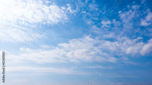 Beautiful blue cloudy sky. Daytime sky, Clouds, sunlight. © MiaStendal
