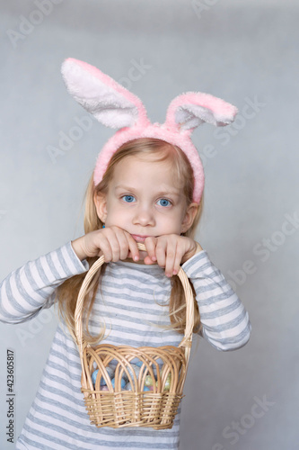Happy girl holding Easter basket