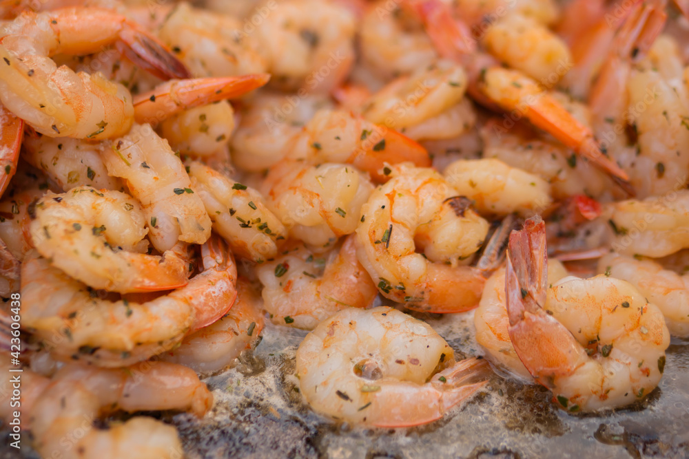 Process of grilling shrimps, prawns on brazier at summer local food market - close up view. Outdoor cooking, gastronomy, seafood, barbecue, street food concept Process of grilling shrimps, prawns on brazier at summer local food market - close up view. Outdoor cooking, gastronomy, seafood, barbecue, street food concept