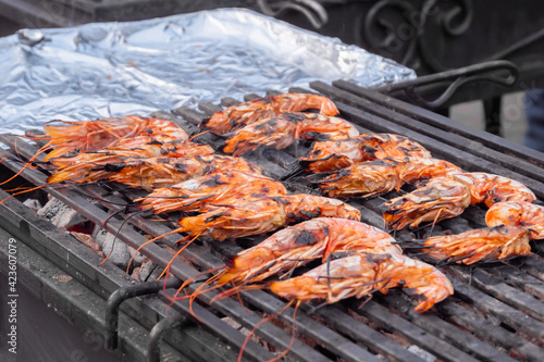 Wallpaper Mural Process of cooking fresh red langoustine shrimps, prawns on grill at summer local food market - close up. Outdoor cooking, barbecue, gastronomy, seafood, cookery, street food concept Torontodigital.ca