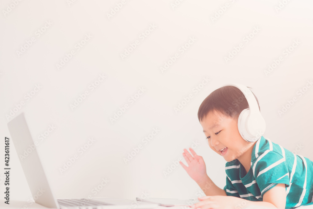 E-learning, online education at home.Online education.Distance learning, Asian kid child school boy online learning with laptop.Smart kid listen teacher talk.Success, programing, homeschool Student. E-learning, online education at home.Online education.Distance learning, Asian kid child school boy online learning with laptop.Smart kid listen teacher talk.Success, programing, homeschool Student.